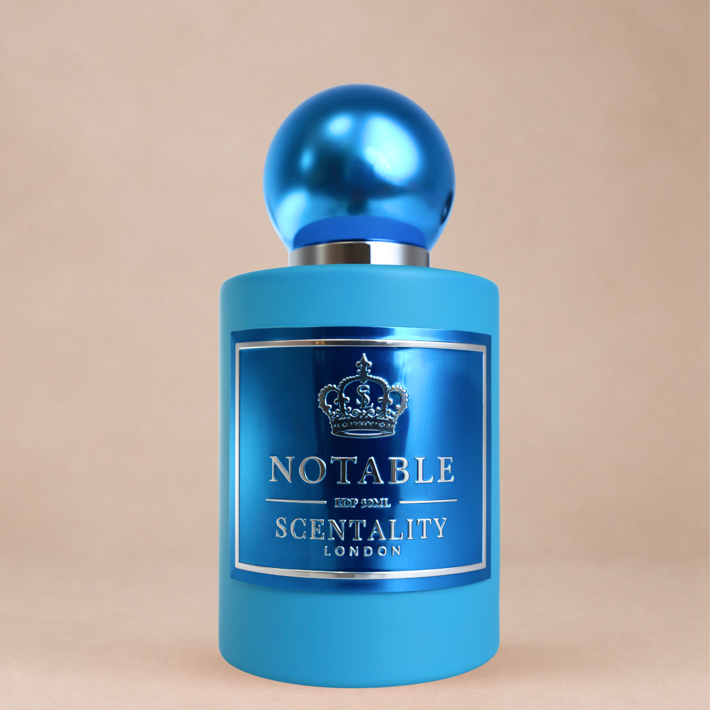 Scentality Notable fragrance, photographed against a warm backdrop